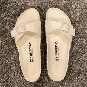 White one-strap Birkenstock’s